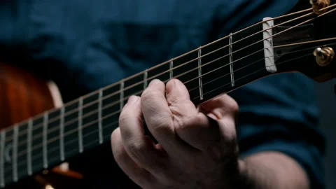 Man's hand on guitar neck Stock Footage 130788438