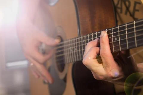 Man's hand with guitar Stock Photos