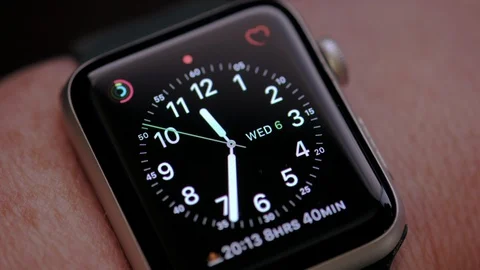 Mans hand as he scrolls through apps on a smart watch Stock Footage 130107182
