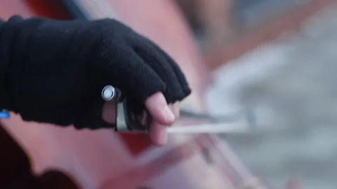 Man's hand with his cello on the outside, winer Stock Footage 233514282