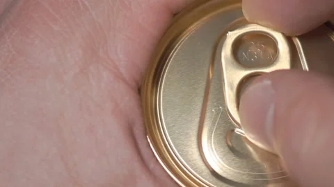 Mans hand with his finger opens a tin can of beer Stock Footage 86127294