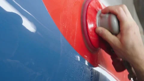 Man's hand hold a professional polish machine and clean the wall of subway car Stock Footage 202049441