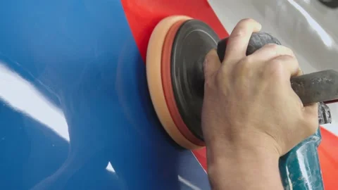 Man's hand hold a rotating polish machine and clean the wall of subway car. the Stock Footage 202049475