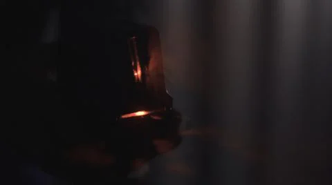 Man's hand holding the barcode scanner and shining in the dark. Stock footage 스톡 사진