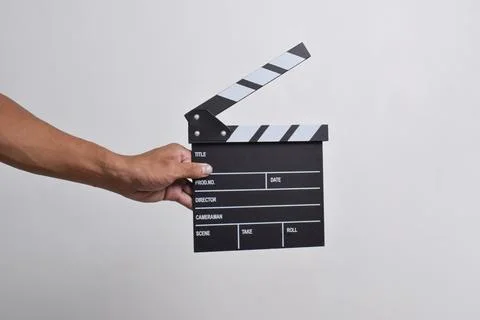 Man's hand holding a Clapper board Stock Photos
