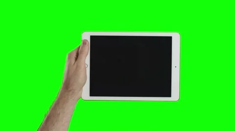 Man's hand holding the new tablet on green screen Video stock 57250257