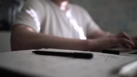 Mans Hand Holding a Pen While Writing on a Notebook. Journaling his thought.. Stock Footage 306064167