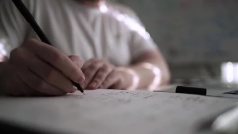 Mans Hand Holding a Pen While Writing on a Notebook. Journaling his thought.. 스톡 동영상 306064196