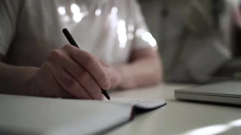 Mans Hand Holding a Pen While Writing on a Notebook. Journaling his thought.. 스톡 동영상 306064197
