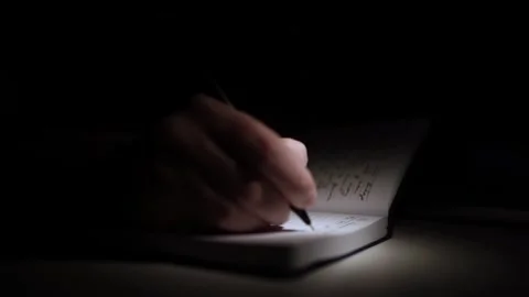 Mans Hand Holding a Pen While Writing on a Notebook. Journaling his thought.. Video stock 306064521