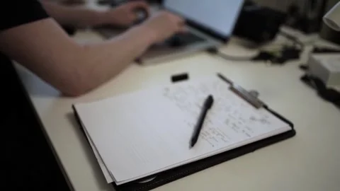 Mans Hand Holding a Pen While Writing on a Notebook. Journaling his thought.. Stock Footage 306064683