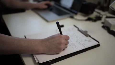 Mans Hand Holding a Pen While Writing on a Notebook. Journaling his thought.. 스톡 동영상 306064697