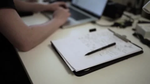Mans Hand Holding a Pen While Writing on a Notebook. Journaling his thought.. Stock Footage 306065765