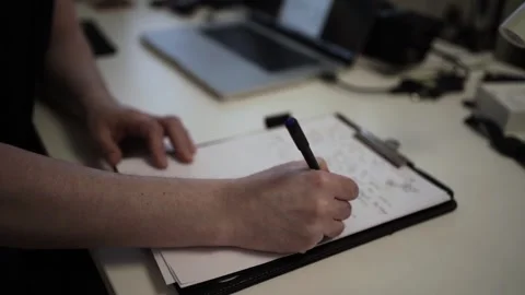 Mans Hand Holding a Pen While Writing on a Notebook. Journaling his thought.. Video stock 306065819