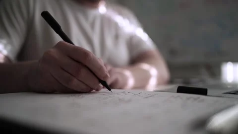 Mans Hand Holding a Pen While Writing on a Notebook. Journaling his thought.. Vidéo 306066111