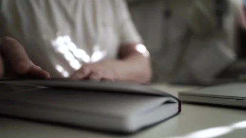 Mans Hand Holding a Pen While Writing on a Notebook. Journaling his thought.. Video stock 306066118