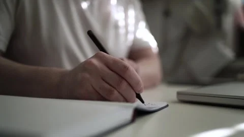 Mans Hand Holding a Pen While Writing on a Notebook. Journaling his thought.. 스톡 동영상 306066132