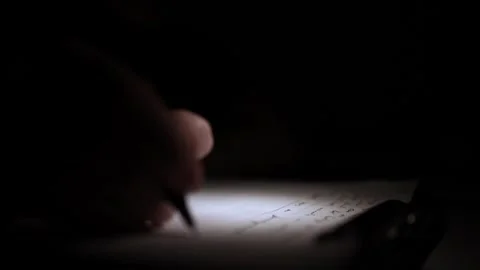Mans Hand Holding a Pen While Writing on a Notebook. Journaling his thought.. Stock-Footage 306066923