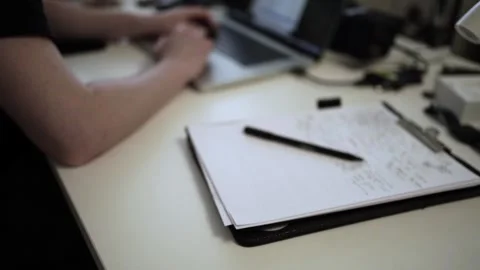 Mans Hand Holding a Pen While Writing on a Notebook. Journaling his thought.. Stock Footage 306067813