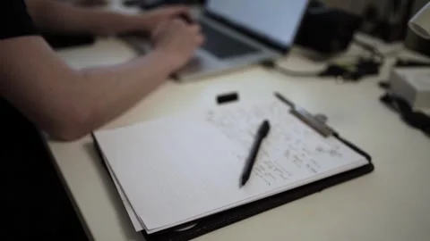 Mans Hand Holding a Pen While Writing on a Notebook. Journaling his thought.. Stock Footage 306067852