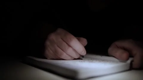 Mans Hand Holding a Pen While Writing on a Notebook. Journaling his thought.. Video stock 306068984
