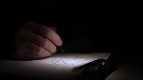 Mans Hand Holding a Pen While Writing on a Notebook. Journaling his thought.. 스톡 동영상 306069014