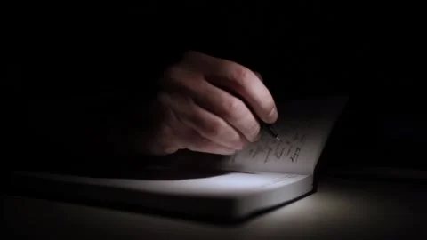 Mans Hand Holding a Pen While Writing on a Notebook. Journaling his thought.. Video stock 306069028