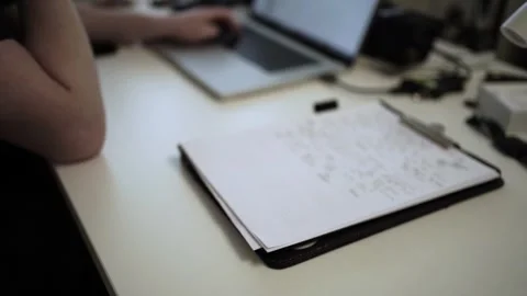 Mans Hand Holding a Pen While Writing on a Notebook. Journaling his thought.. Stock Footage 306069038