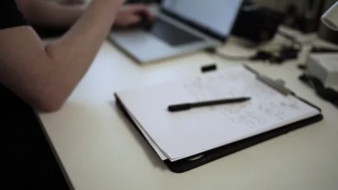 Mans Hand Holding a Pen While Writing on a Notebook. Journaling his thought.. Stock Footage 306069050