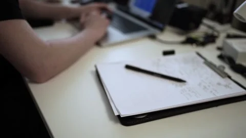 Mans Hand Holding a Pen While Writing on a Notebook. Journaling his thought.. Stock Footage 306069065