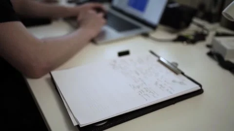 Mans Hand Holding a Pen While Writing on a Notebook. Journaling his thought.. Vídeo Stock 306069073