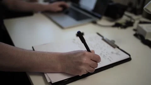 Mans Hand Holding a Pen While Writing on a Notebook. Journaling his thought.. 스톡 동영상 306069124