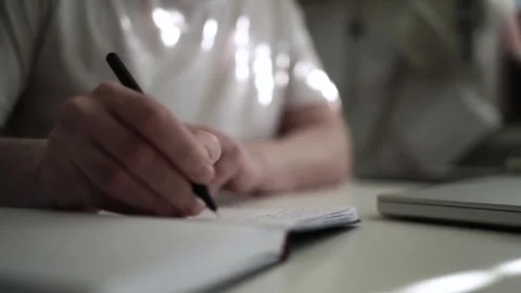 Mans Hand Holding a Pen While Writing on a Notebook. Journaling his thought.. 스톡 동영상 306069143