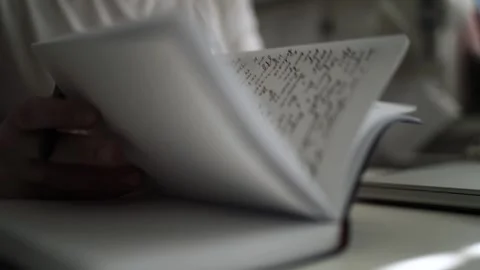 Mans Hand Holding a Pen While Writing on a Notebook. Journaling his thought.. 스톡 동영상 306069152