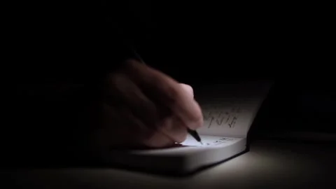 Mans Hand Holding a Pen While Writing on a Notebook. Journaling his thought.. Video stock 306069182
