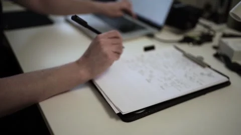 Mans Hand Holding a Pen While Writing on a Notebook. Journaling his thought.. Video stock 306069202