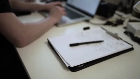 Mans Hand Holding a Pen While Writing on a Notebook. Journaling his thought.. Stock Footage 306069216