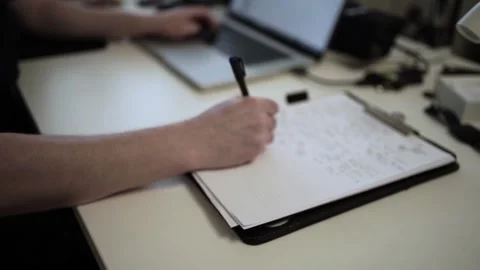 Mans Hand Holding a Pen While Writing on a Notebook. Journaling his thought.. Vídeo Stock 306069223
