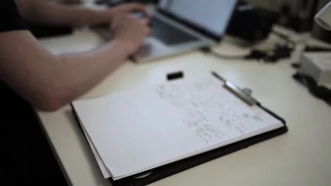 Mans Hand Holding a Pen While Writing on a Notebook. Journaling his thought.. Stock Footage 306069236