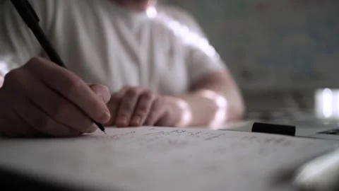 Mans Hand Holding a Pen While Writing on a Notebook. Journaling his thought.. 스톡 동영상 306069286