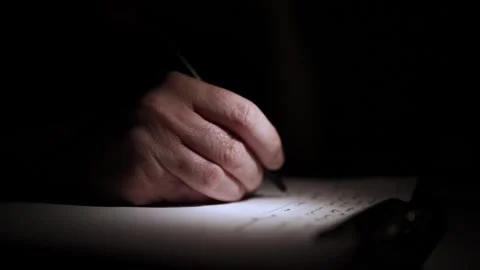 Mans Hand Holding a Pen While Writing on a Notebook. Journaling his thought.. Stock Footage 306069330