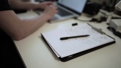 Mans Hand Holding a Pen While Writing on a Notebook. Journaling his thought.. Stock Footage 306069351