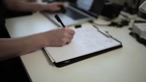 Mans Hand Holding a Pen While Writing on a Notebook. Journaling his thought.. 스톡 동영상 306069355