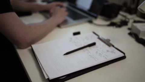 Mans Hand Holding a Pen While Writing on a Notebook. Journaling his thought.. Stockbeeldmateriaal 306069400