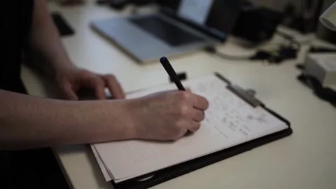 Mans Hand Holding a Pen While Writing on a Notebook. Journaling his thought.. Stock-Footage 306069408