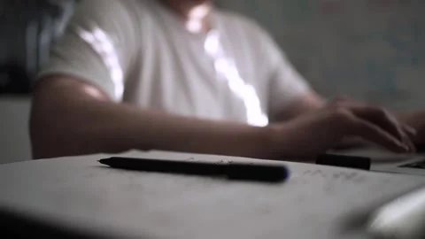 Mans Hand Holding a Pen While Writing on a Notebook. Journaling his thought.. Video stock 306069409