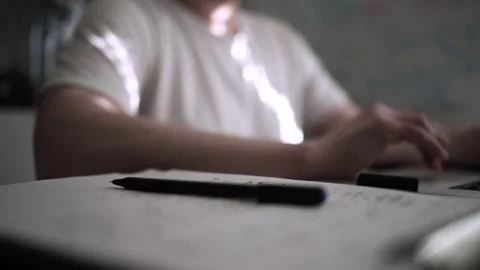 Mans Hand Holding a Pen While Writing on a Notebook. Journaling his thought.. Video stock 306070216