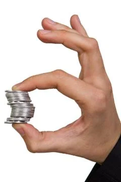 Man's hand holding a stack of silver coins Stock Photos
