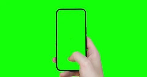 A man's hand holds a smartphone with an empty green screen with tracking ma.. Stock Footage 243003235