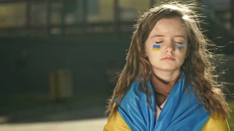 Man's hand with the image of the Russian flag roughly pulls the hand of a little Stock Footage 178394593